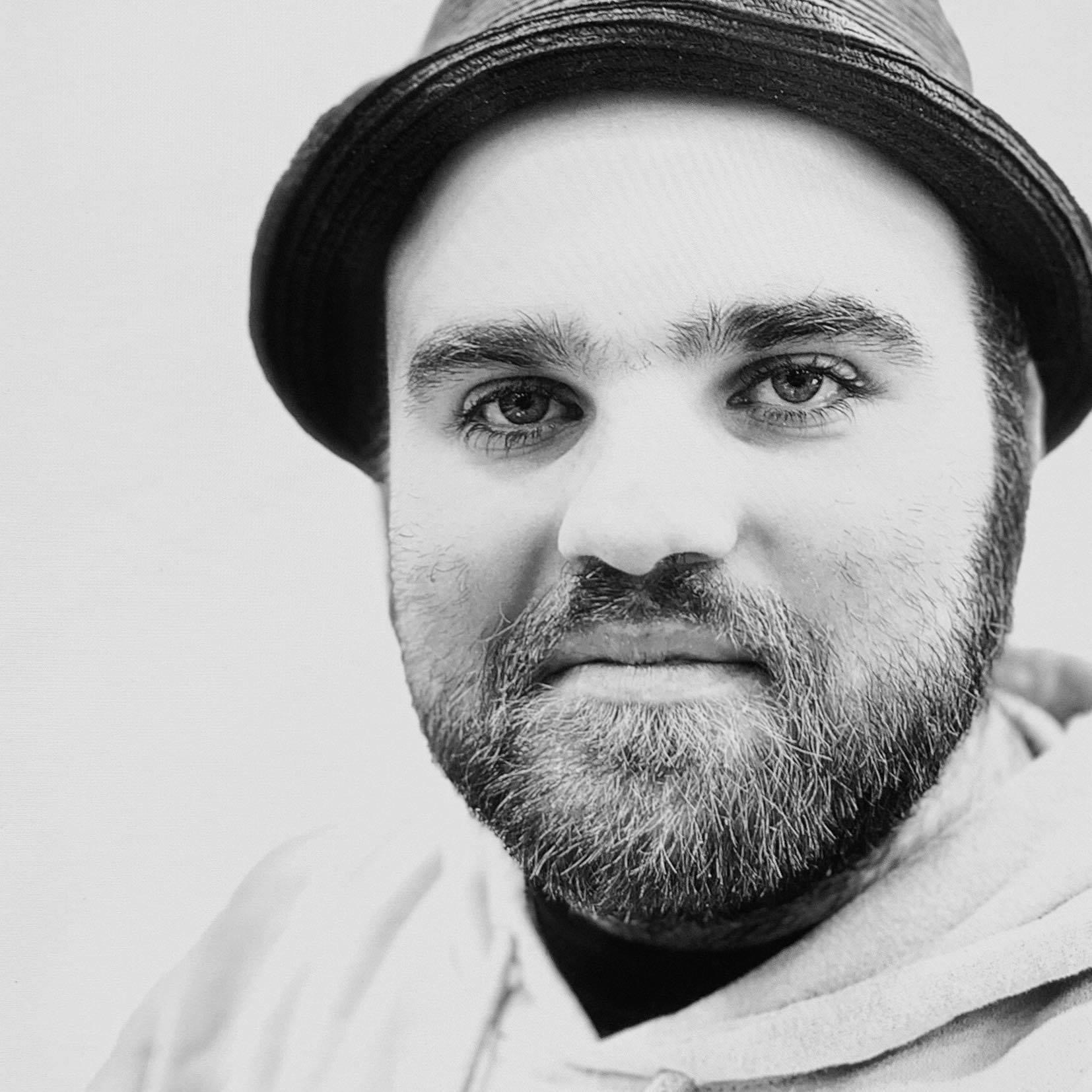 Nick from Nick Burrows Photography smiling in a portrait picture of himself.