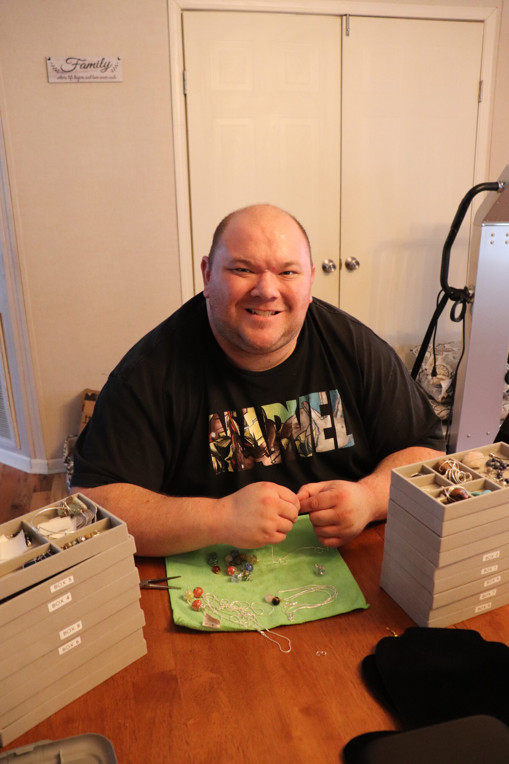 Andrew Burchfield from Dream Chaser Jewelry at his workshop table working on a project.