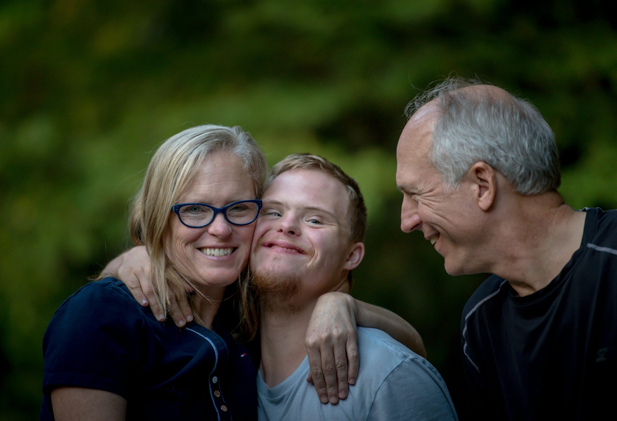 Family smiling with son