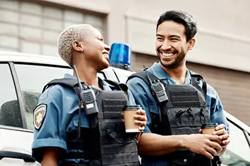 Two police officers smiling together